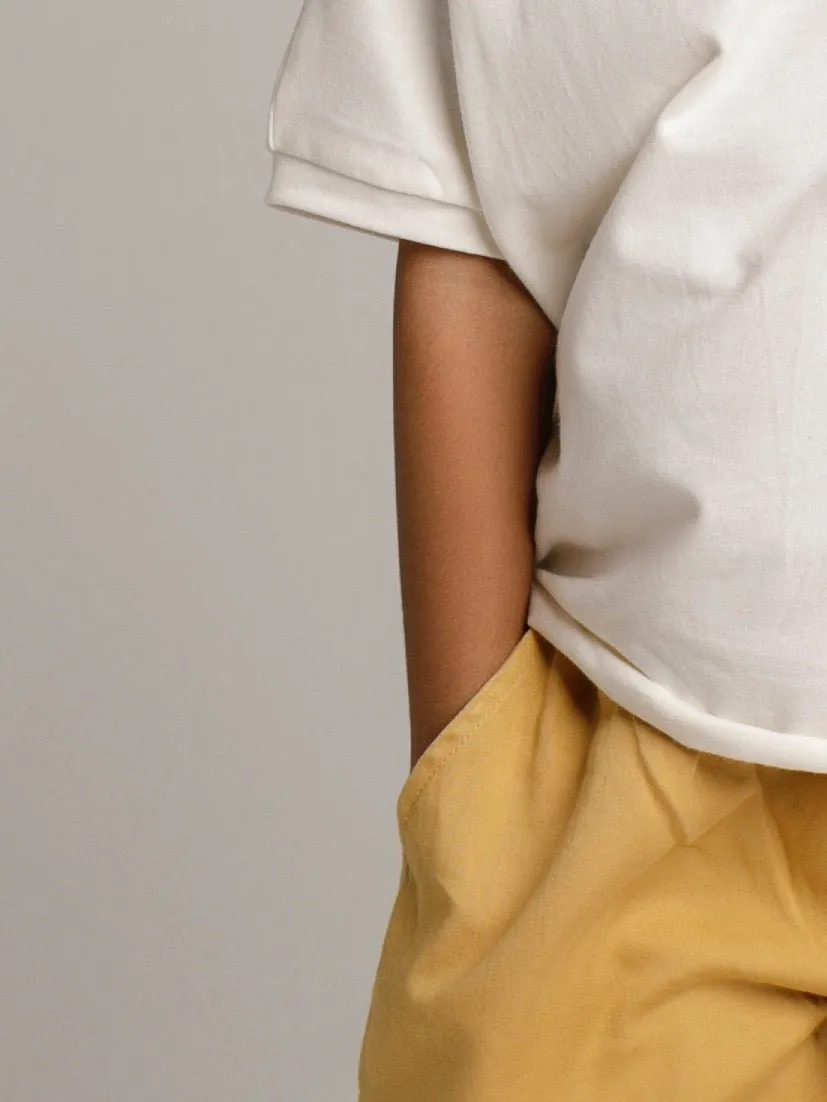 Unisex children organic pants in yellow