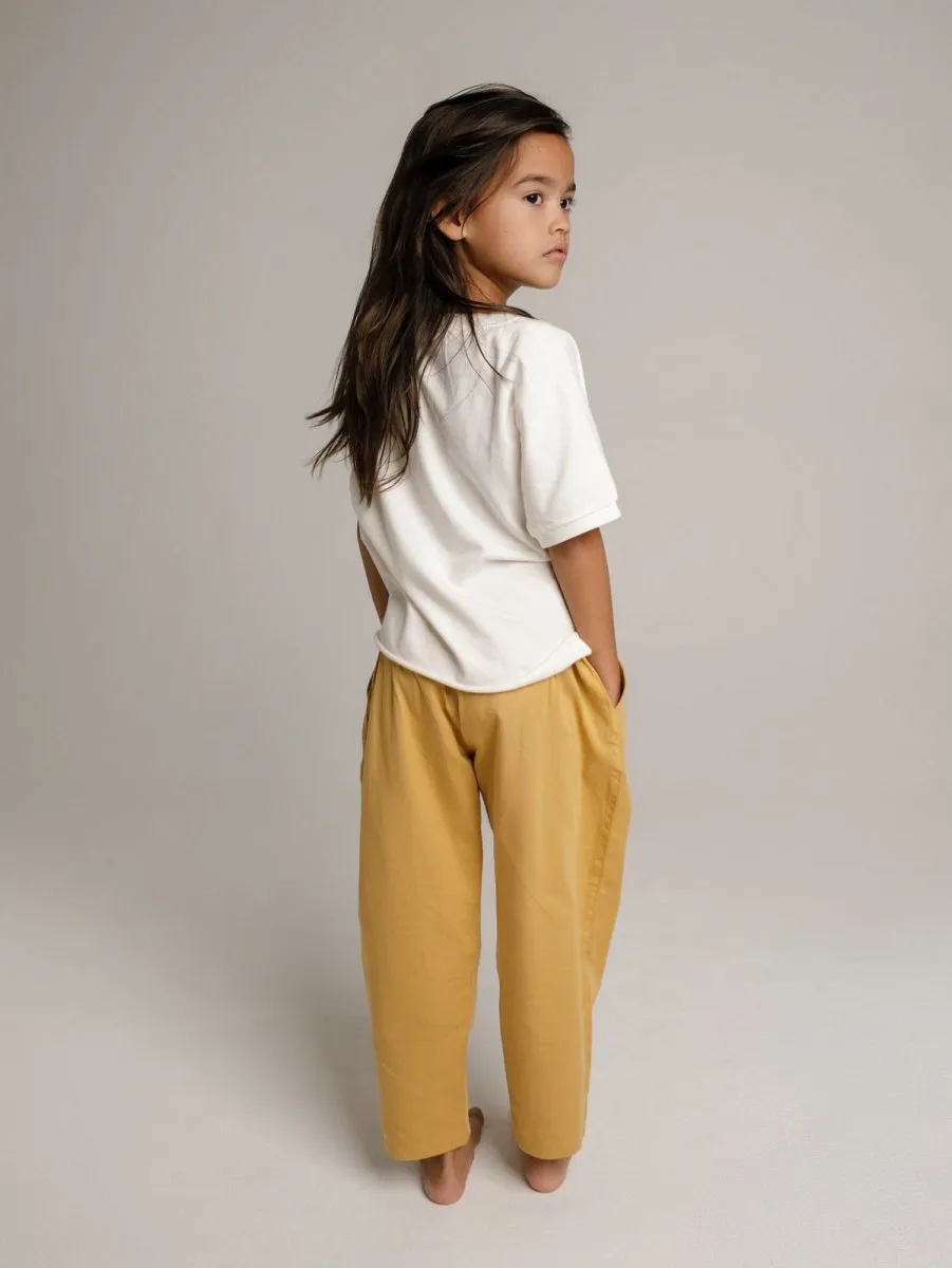 Unisex children organic pants in yellow